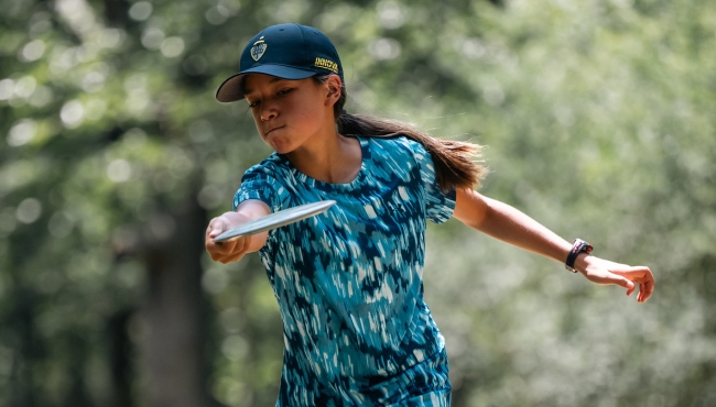 Junior aged player tees off